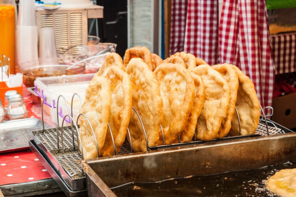 Traditional hungarian fried bread langos sold at a street vendor