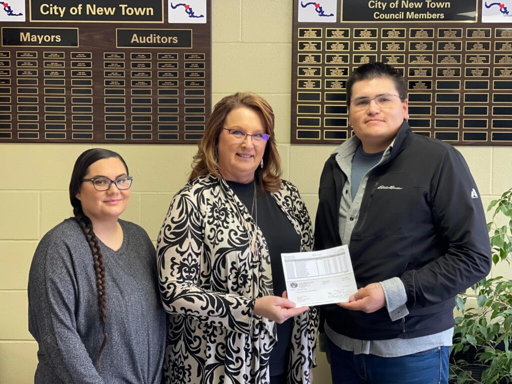 North Segment delivers check to City of New Town Water Accounts